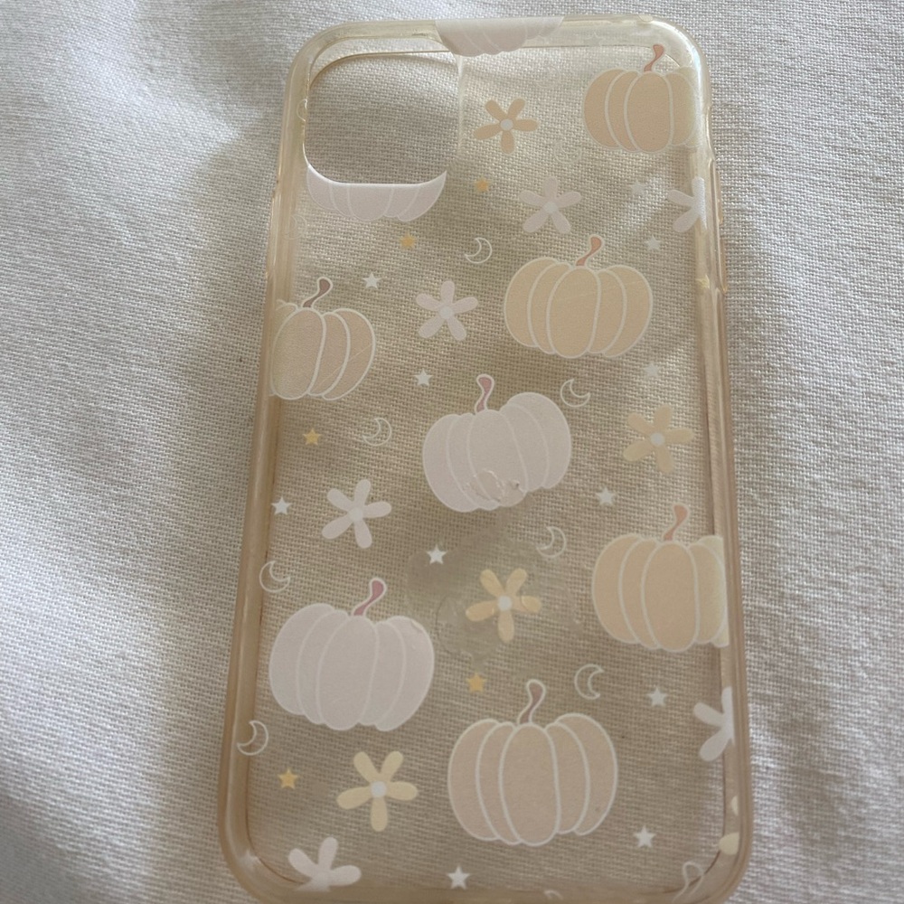 An iPhone 11 phone case with pumpkins moon & stars